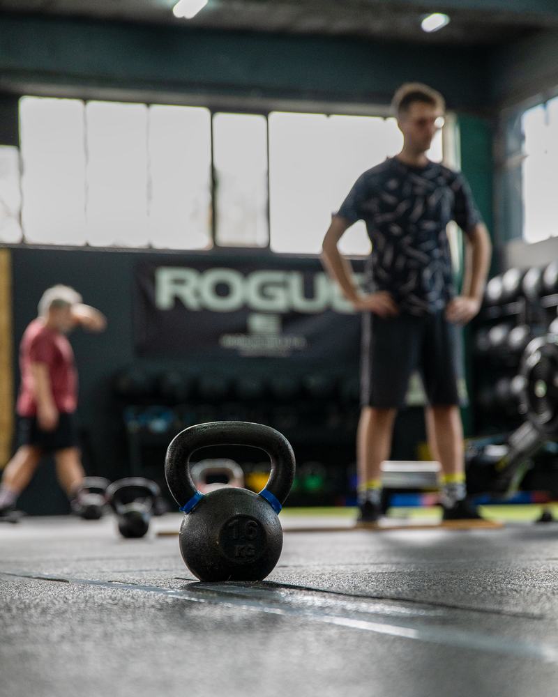 Coach guiding a member during training at Royal CrossFit