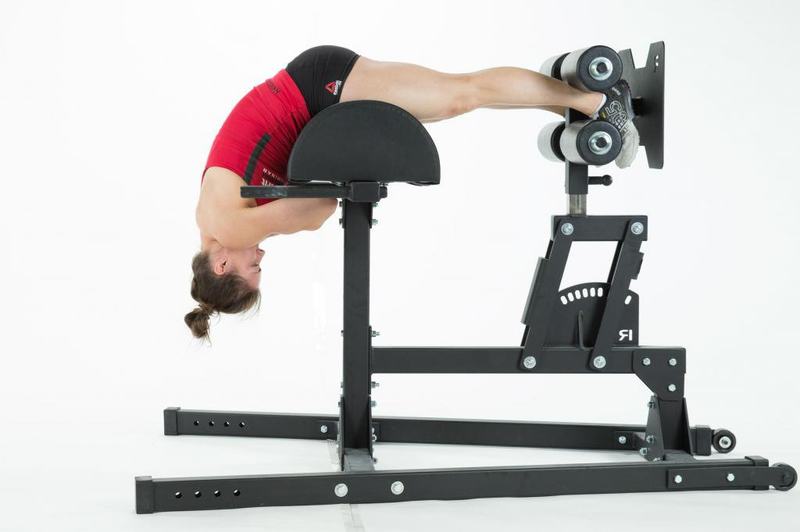 The bottom position of the back extension. Note the pad is positioned under the hips, not the quads