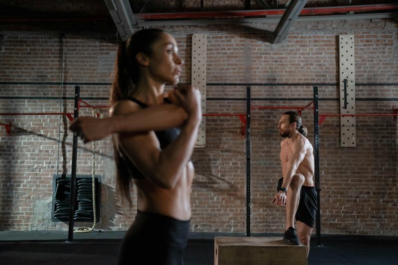 An athlete resting and stretching after a workout