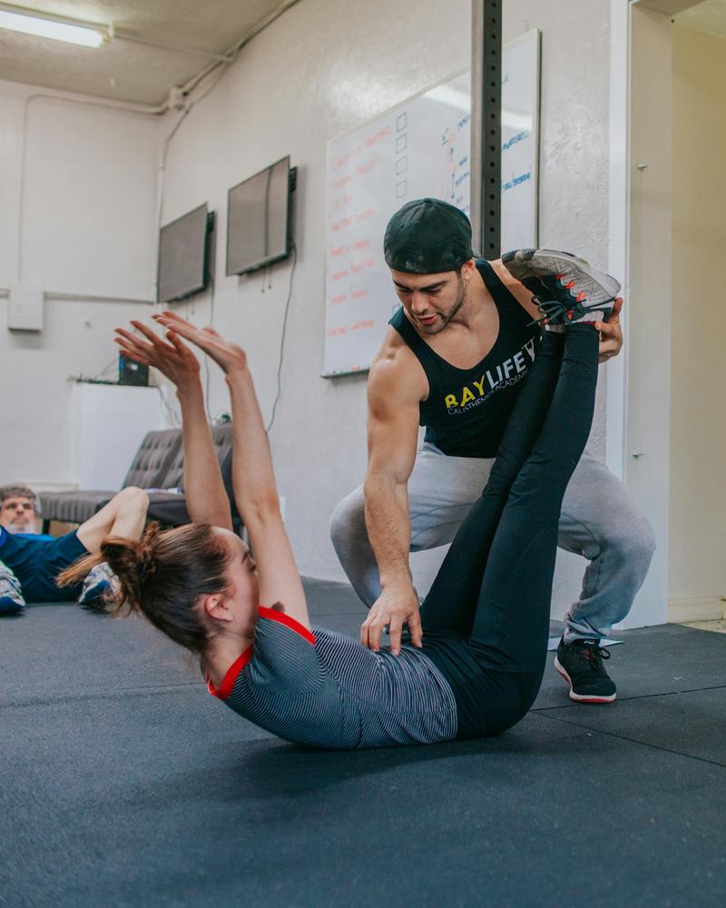 Coach guiding an athlete during personal training at Royal CrossFit